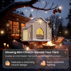 Church-shaped solar bird feeder glowing in a snowy backyard at night