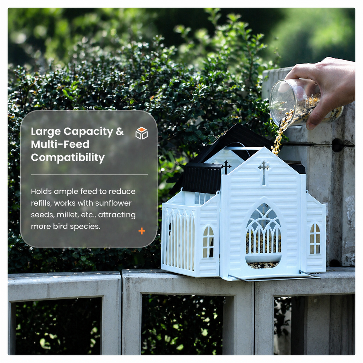 Large-capacity church-shaped bird feeder being filled with mixed birdseed